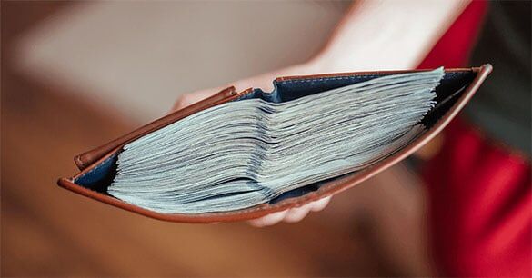 Wallet with lots of bills inside